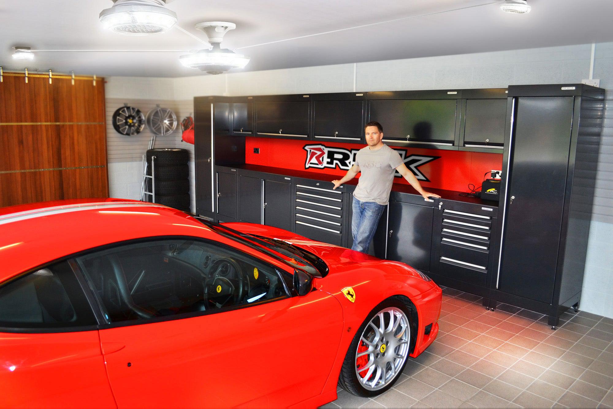 Red Ferrari parked in a nice garage under an MPI full garage lighting system