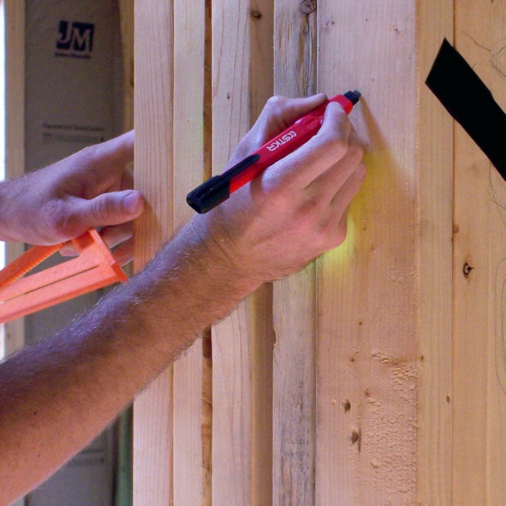 STKR's Mechanical Carpenter Pencil - male arm in frame shown marking framing inside an unfinished home