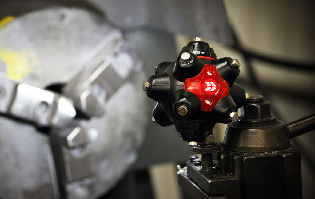 the STKR magnetic light mine pro posing on and lighting up a lathe