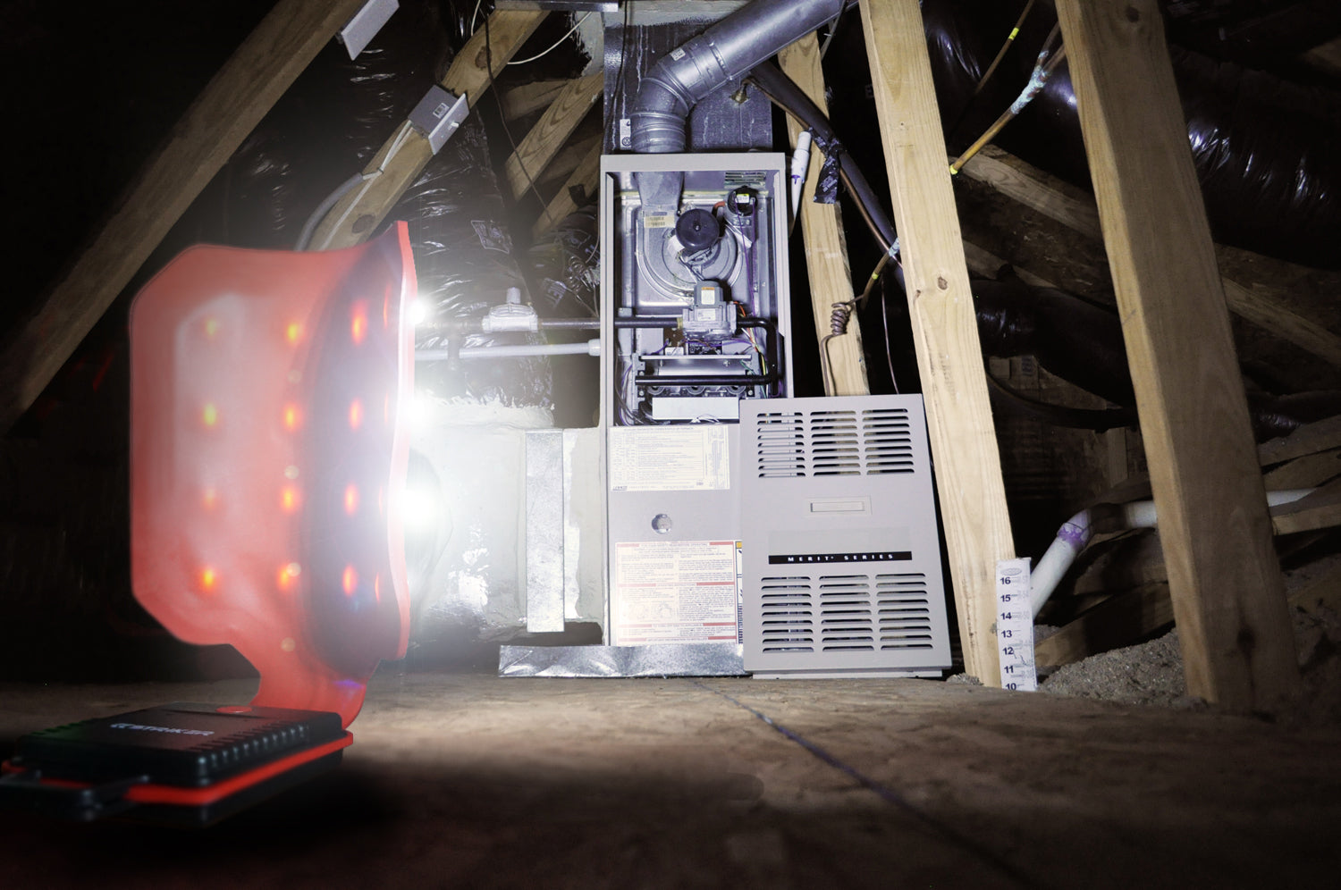 attic scene with an HVAC lit up by a FLEXIT 2.0 by STKR