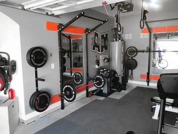 home gym featuring free weights and TRilight Ceiling light