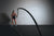 female working out using oversized ropes in a dark basement gym setting