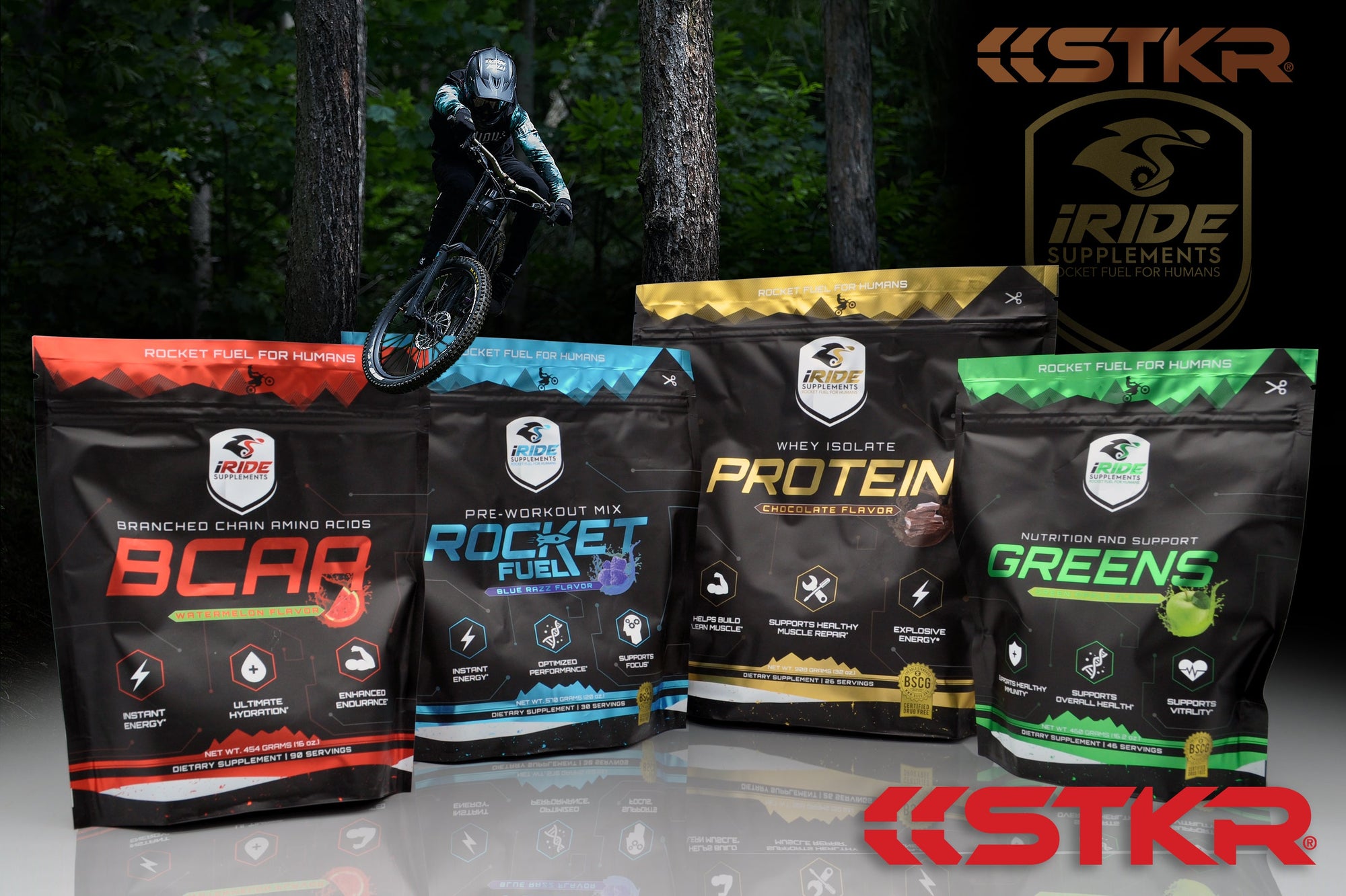 iRide Supplements. 4 bags of drink mixes lined up with a mountain biker jumping over them.