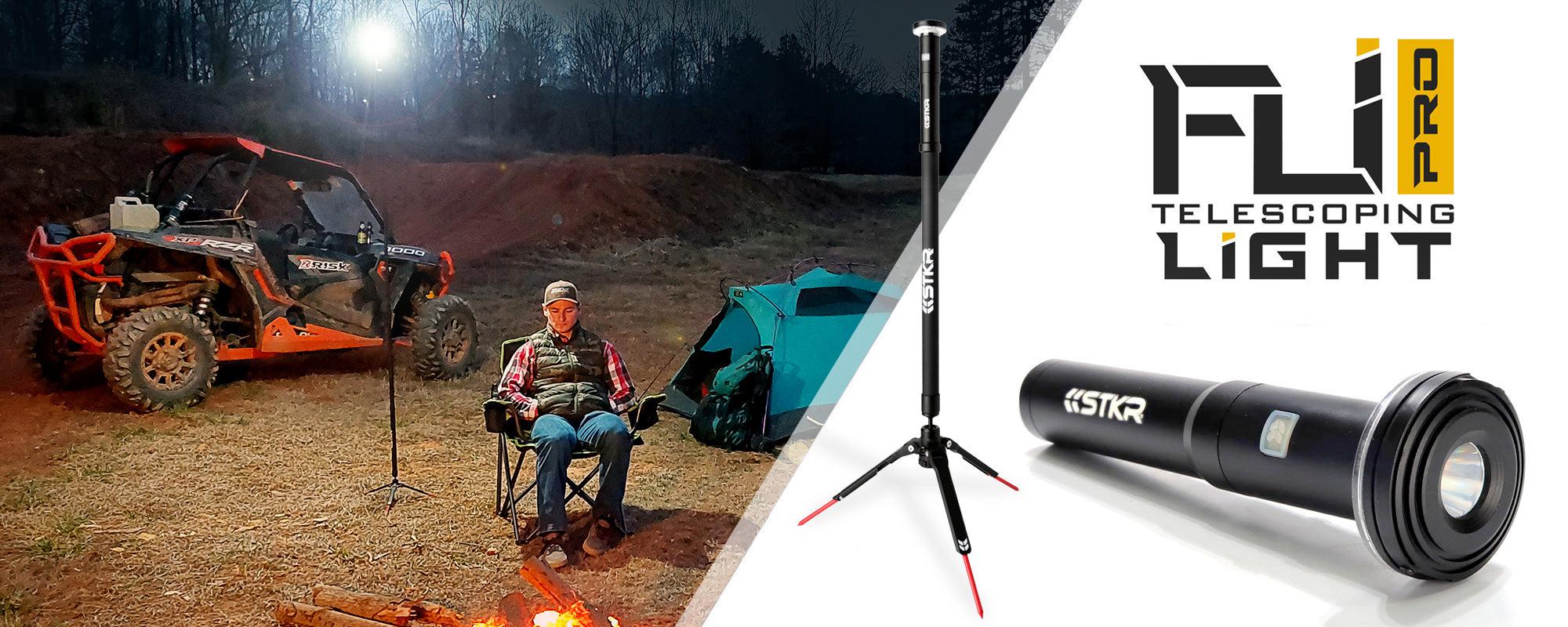 FLi-PRO homepage banner featuring an off-road camping scene and a white studio shot of the flashlight and the telescoping tripod. Camper sitting in a chair with a tent and side-by-side behind him. Campsite illuminated by the FLi-PRO that's 8' feet up.