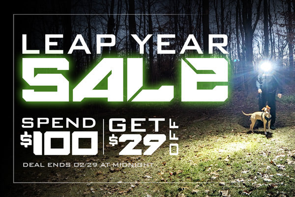 Leap Year Sale. Spend $100, Get $29 Off. Deal Ends 02/29 at midnight. Background pic of a man walking his dog at night wearing a FLEXIT Headlamp.