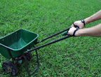 Palm Protectors worn while pushing a lawn spreader across grass