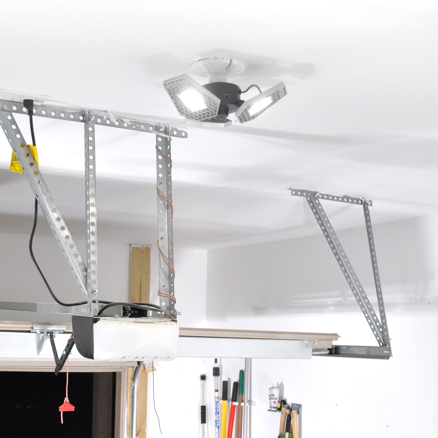 Upgrade dim light bulb in garage with bright LED motion sensing light - TRiLIGHT | STKR Concepts - striker