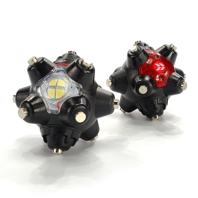 Two black multi-directional LED lights with various colored lenses.